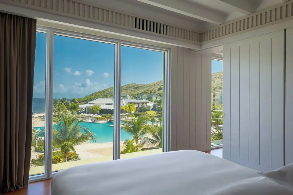 Suite bedroom with king bed and resort views at Park Hyatt St. Kitts.