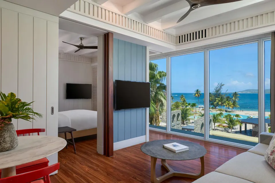 Suite living room and bedroom with ocean views at Park Hyatt St. Kitts.