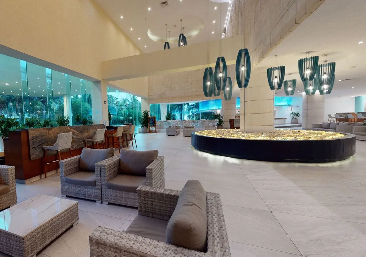 Modern lobby seating and pendant lights at Park Royal Beach Cancun.
