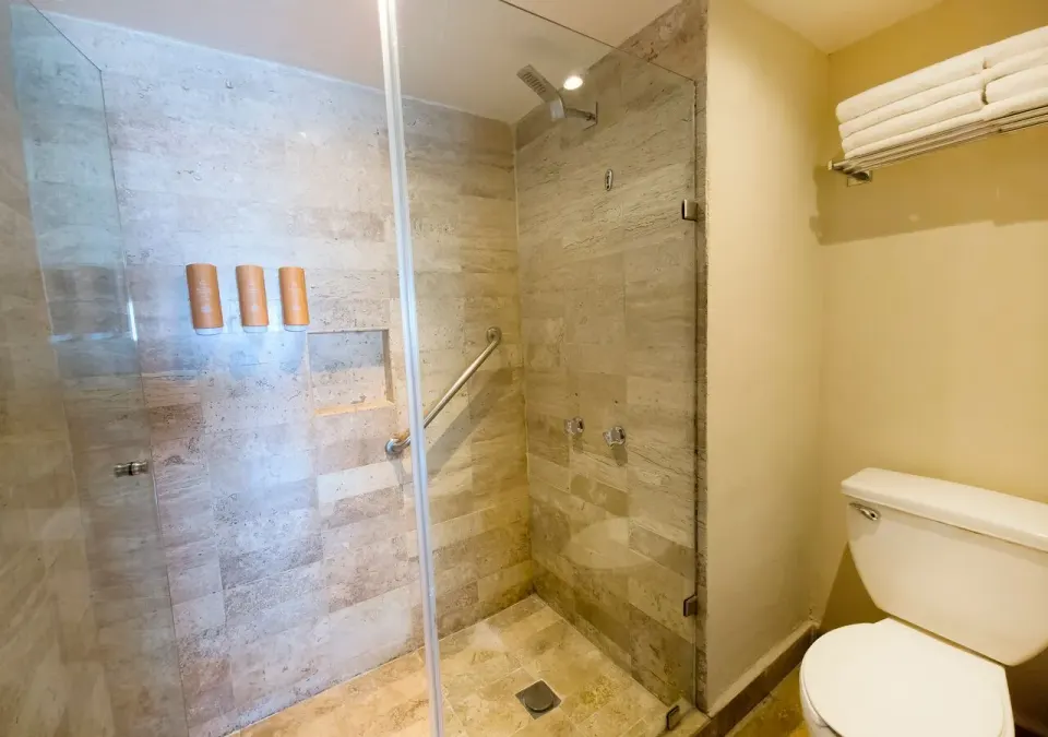 Family Suite bathroom shower and toilet area at Park Royal Beach Cancun.