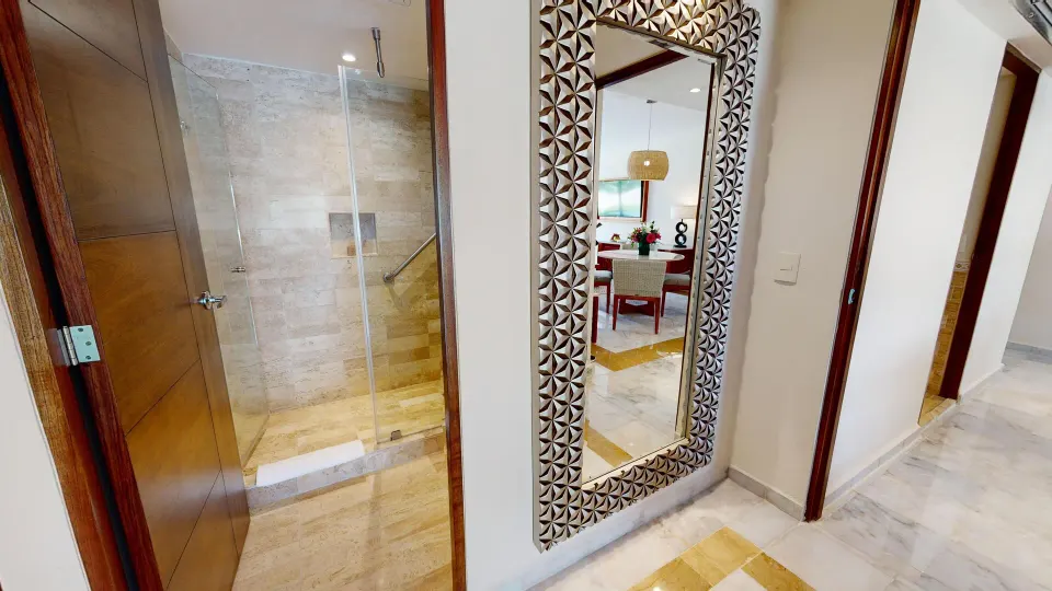 Family Suite hallway with shower entrance and full-length mirror at Park Royal Beach Cancun.