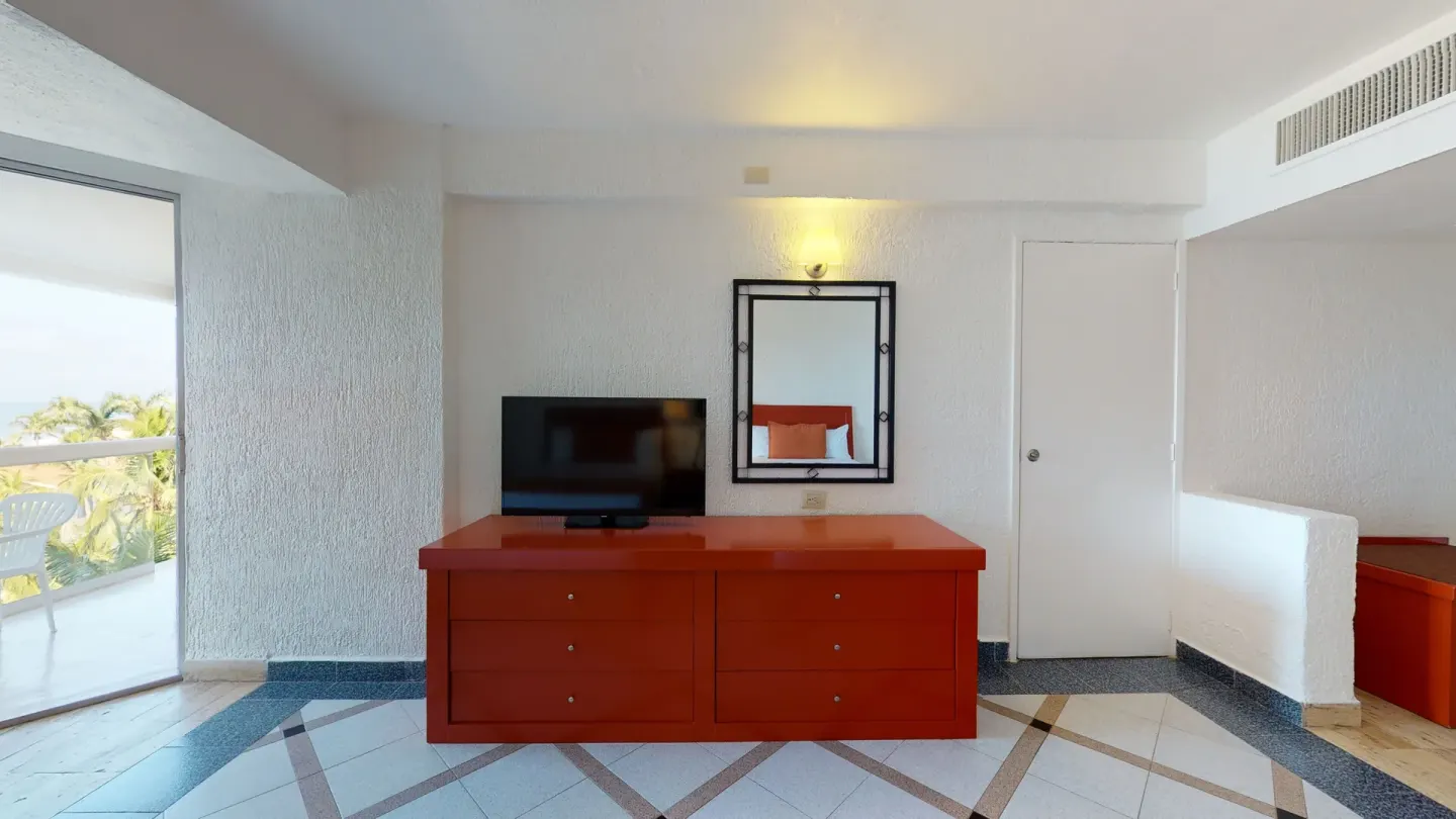 Deluxe Nature View room dresser and balcony at Park Royal Beach Ixtapa.