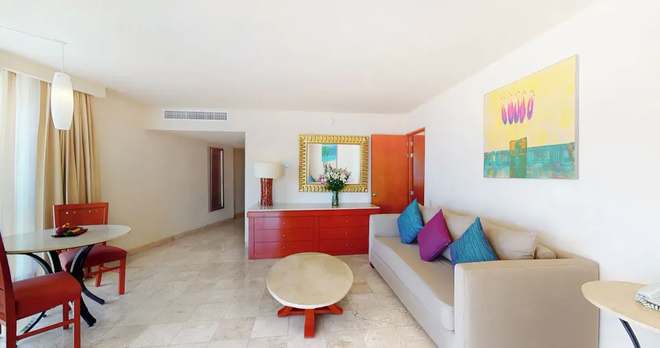 Master Suite living area with sofa and dining table at Park Royal Beach Ixtapa.