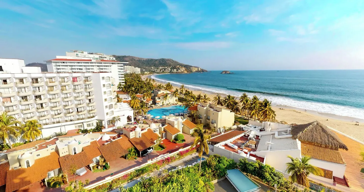 Master Suite ocean-view balcony outlook at Park Royal Beach Ixtapa, with beach, pool, and resort buildings.