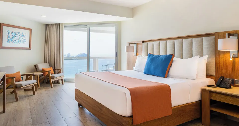 Royal Ocean Front king bed and balcony ocean view at Park Royal Beach Ixtapa.