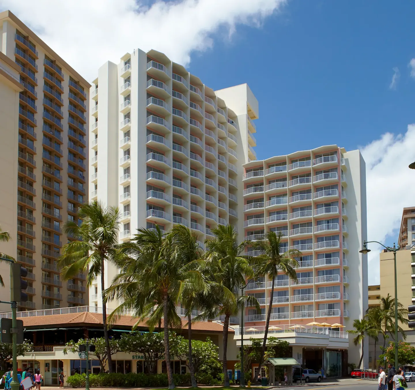 Exterior tower with balconies and palm trees at Park Shore Waikiki.