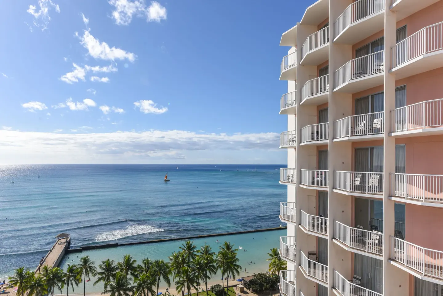 Balconies overlook the ocean and Waikiki shoreline at Park Shore Waikiki.