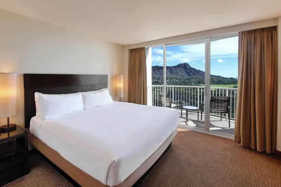 Premier Ocean View room with king bed and balcony at Park Shore Waikiki.