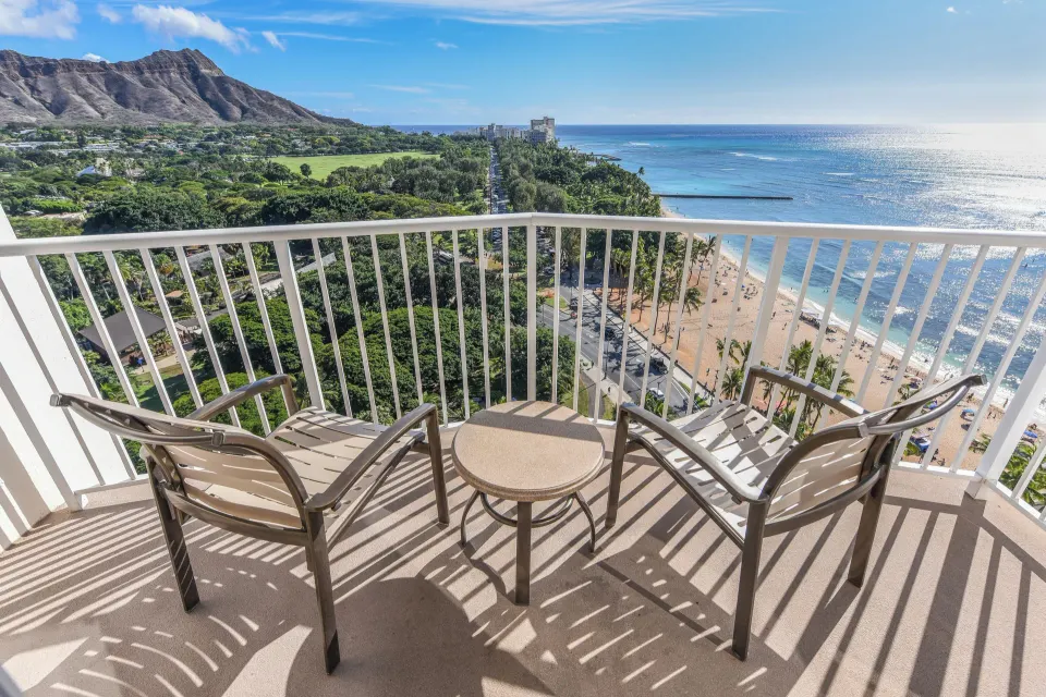 Corner balcony with chairs facing Diamond Head and the ocean at Park Shore Waikiki.
