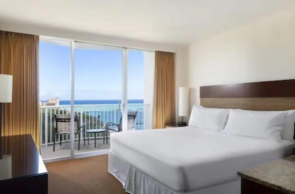 Ocean View room with a king bed and balcony at Park Shore Waikiki.