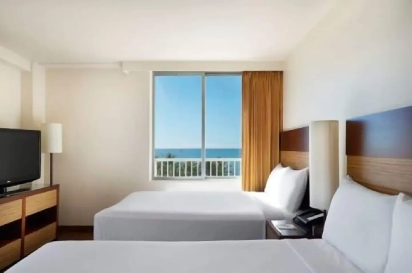 Ocean View room with two beds and a window view at Park Shore Waikiki.