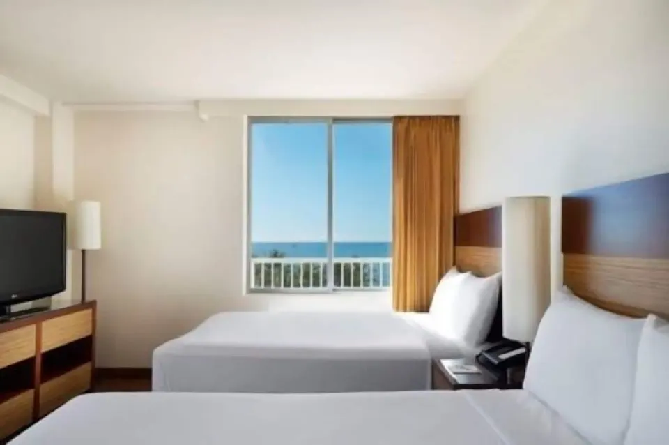 Ocean View room with two beds and a window view at Park Shore Waikiki.