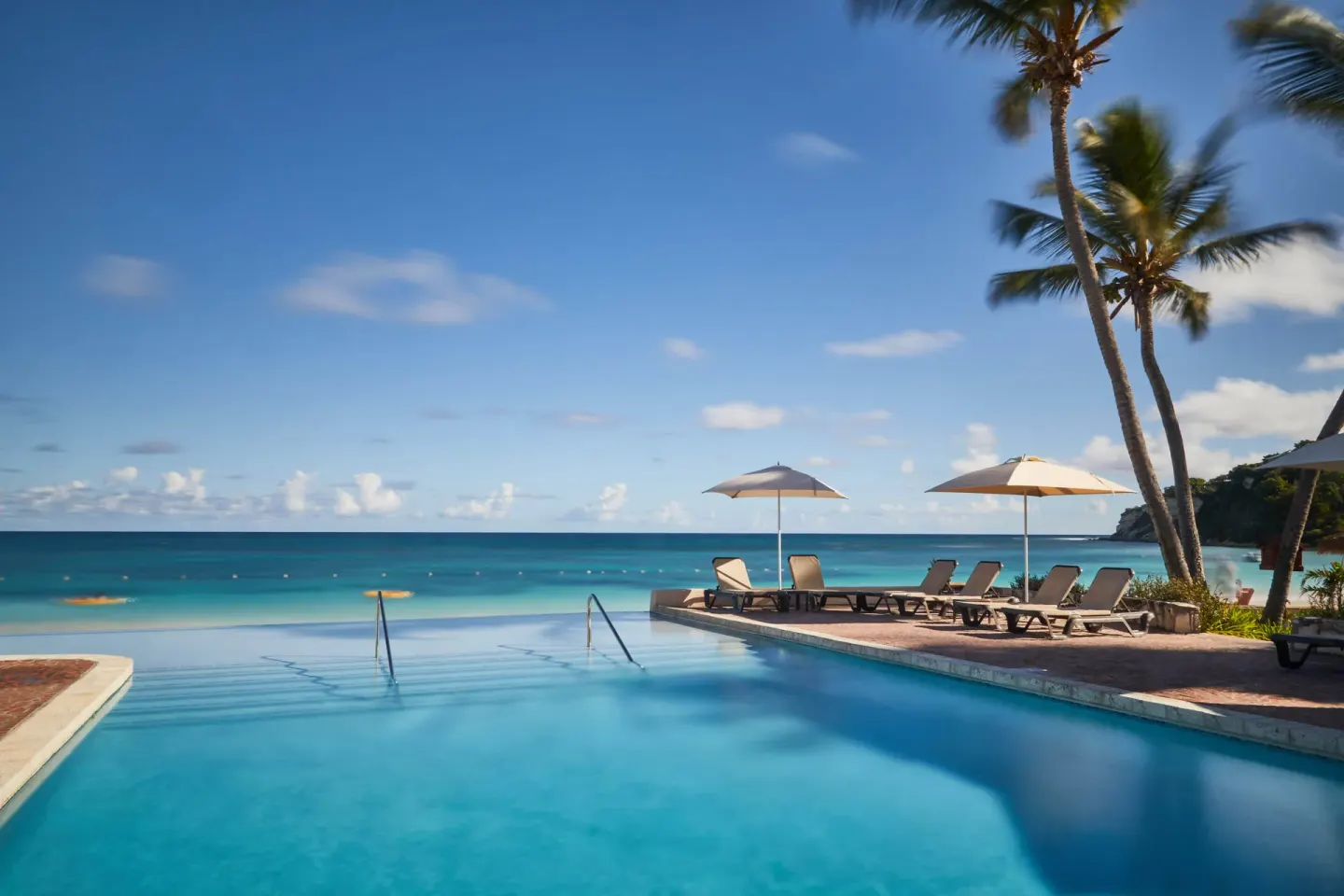Beachfront pool overlooking the ocean at Pineapple Beach Club Antigua.