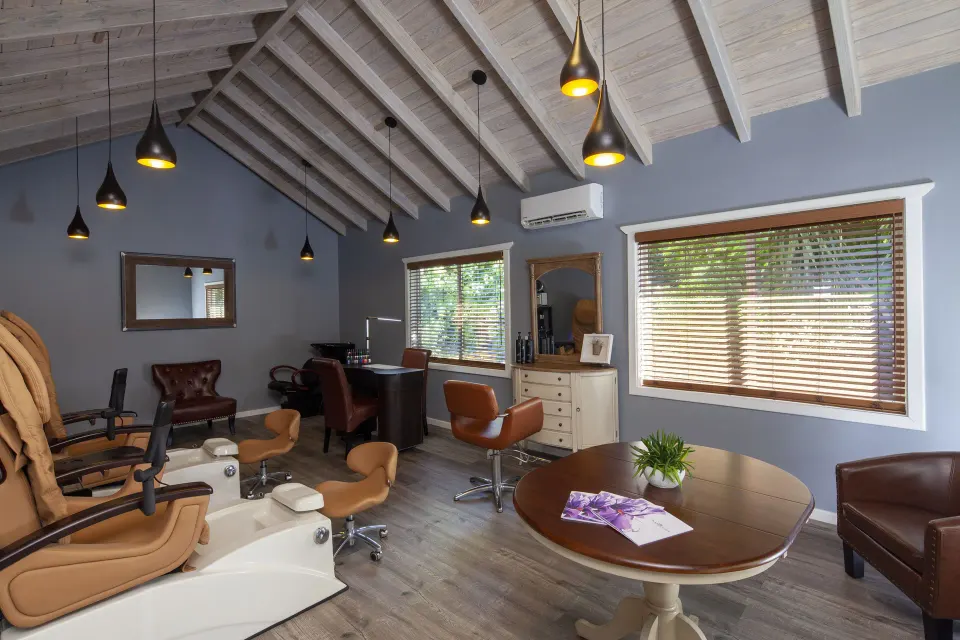 Spa salon room with pedicure chairs and styling stations at Pineapple Beach Club Antigua.