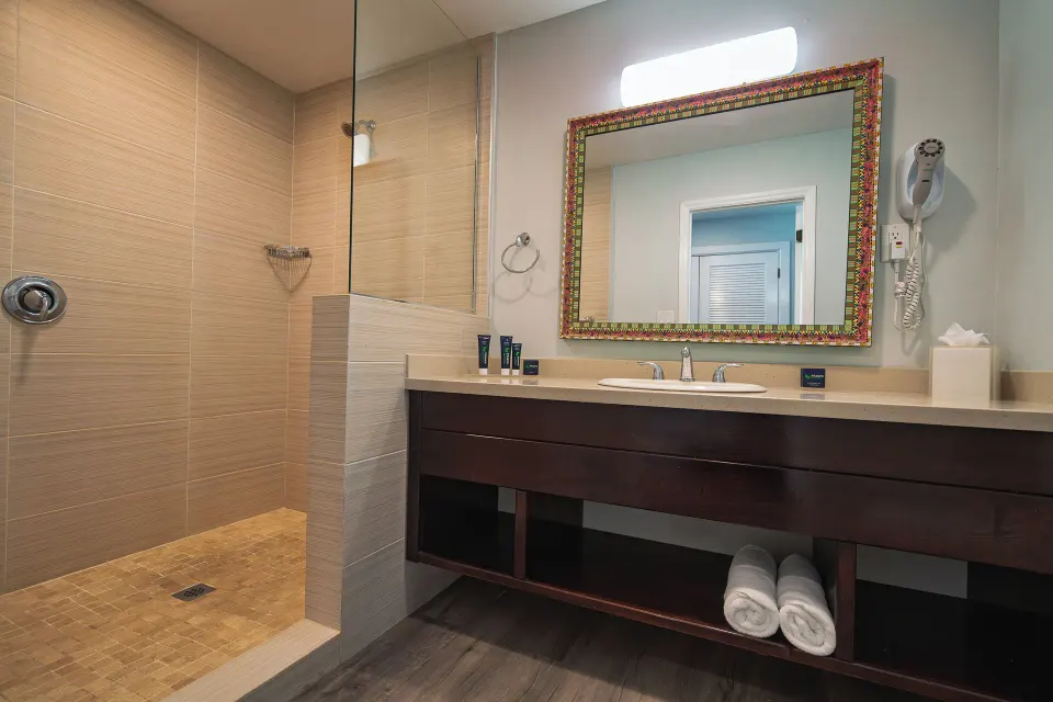 Beachfront room bathroom vanity and shower at Pineapple Beach Club Antigua.