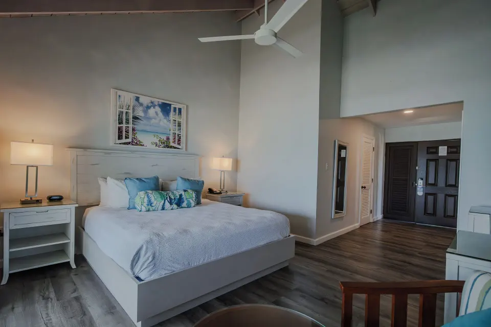 Beachfront king guest room with high ceiling and entry area at Pineapple Beach Club Antigua.