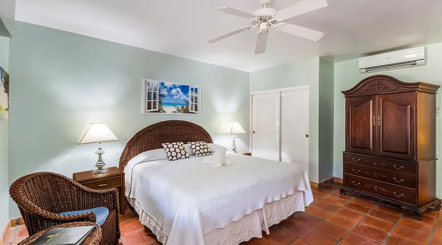Gardenview Room king bed at Pineapple Beach Club Antigua with tropical garden views and serene island atmosphere.