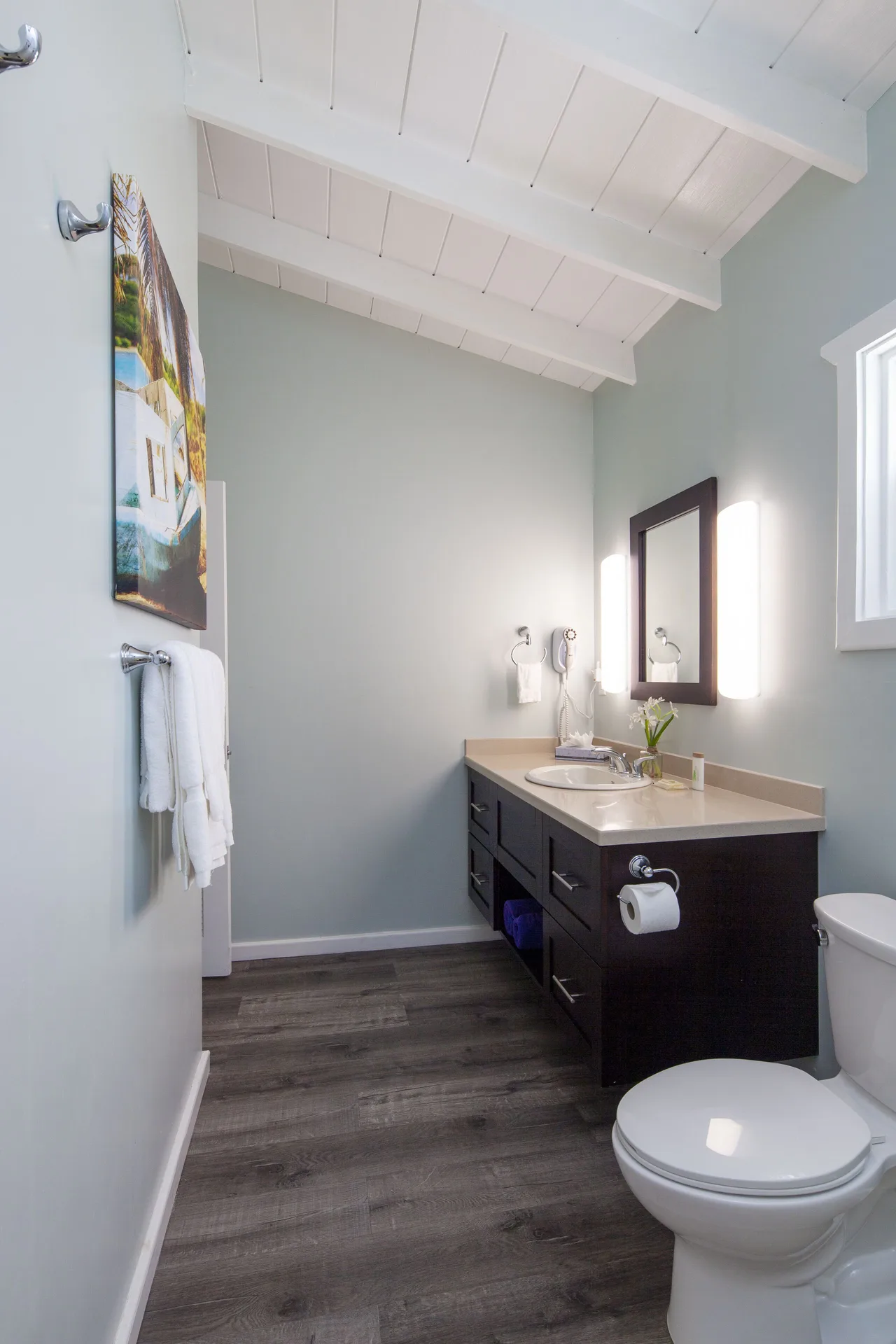 Gardenview Room bathroom with vanity and toilet at Pineapple Beach Club Antigua.