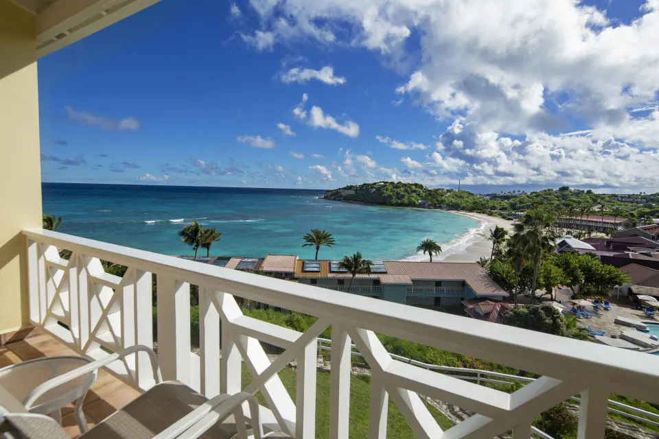 Oceanview balcony with beach and bay view at Pineapple Beach Club Antigua.