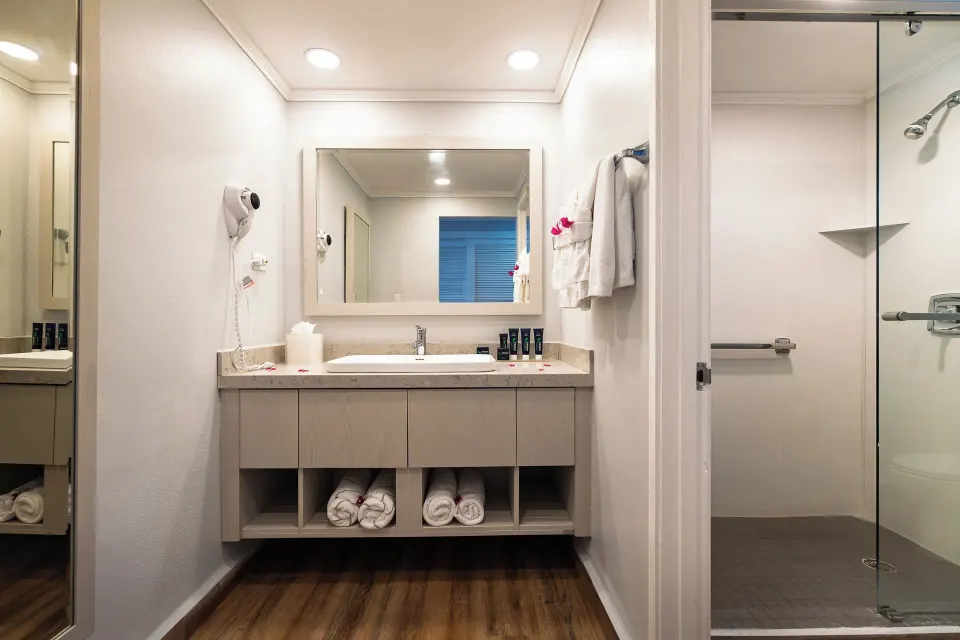 Oceanview room bathroom vanity with walk-in shower at Pineapple Beach Club Antigua.