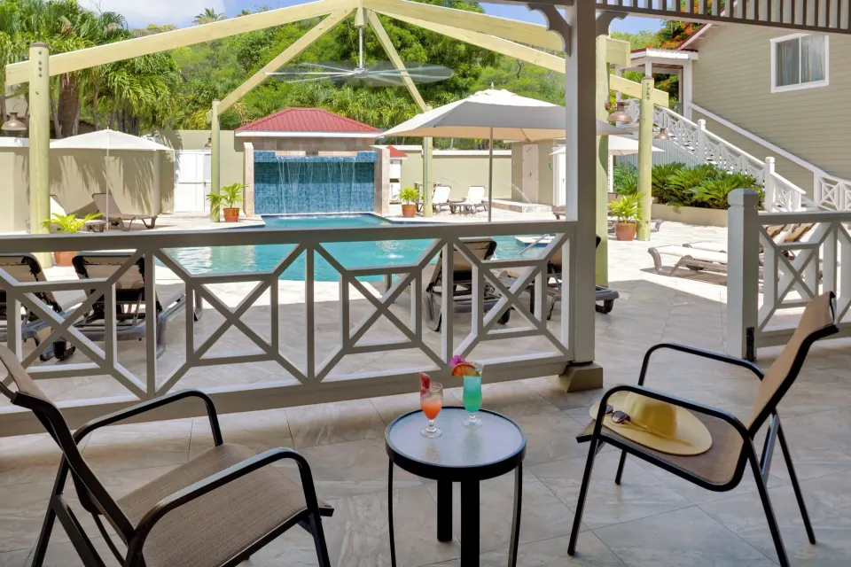 Pool Terrace patio seating beside the pool at Pineapple Beach Club Antigua.