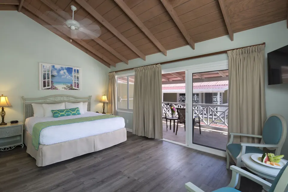 Pool Terrace king room with balcony seating at Pineapple Beach Club Antigua.