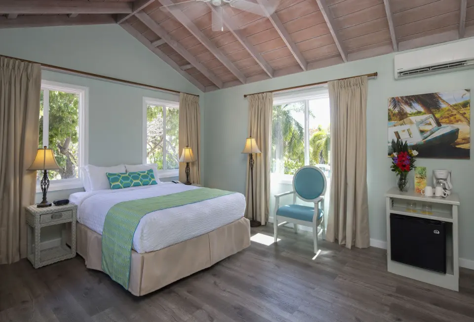 Pool Terrace king room with windows and refreshment nook at Pineapple Beach Club Antigua.