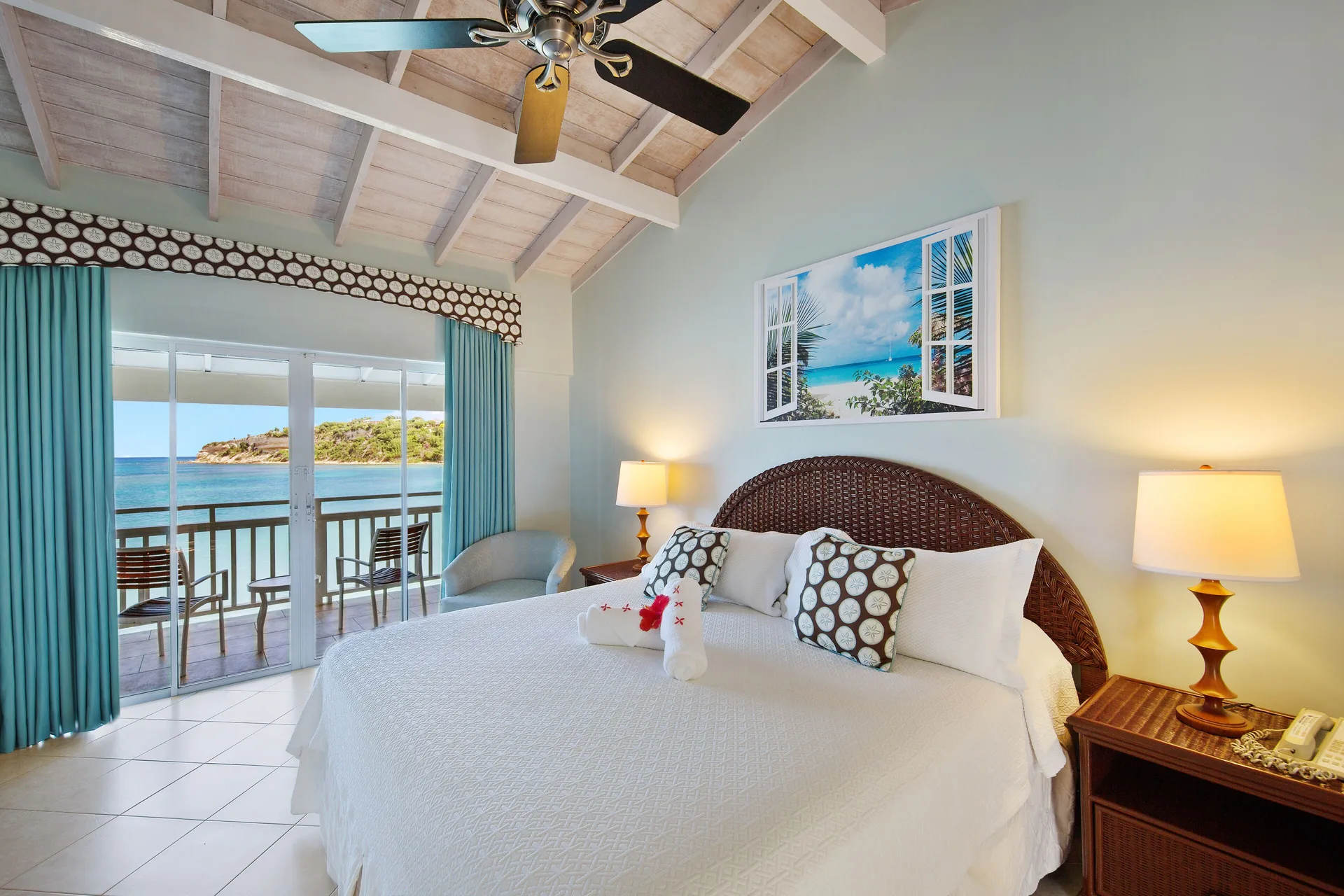 Waterfront king room with balcony and sea view at Pineapple Beach Club Antigua.