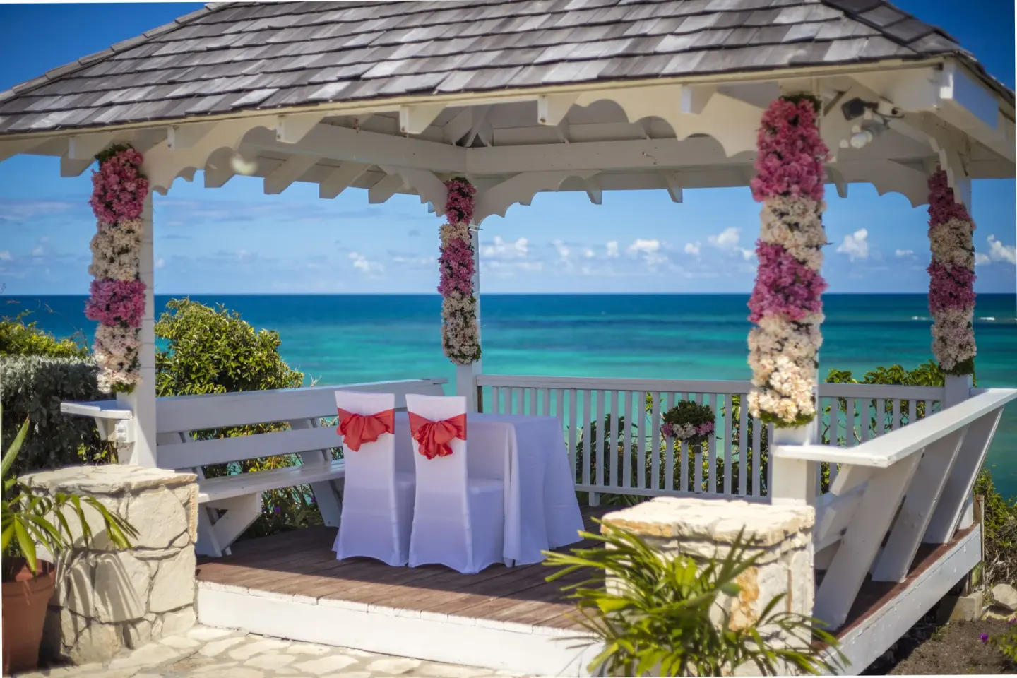 Oceanfront wedding gazebo with floral-wrapped posts at Pineapple Beach Club Antigua.