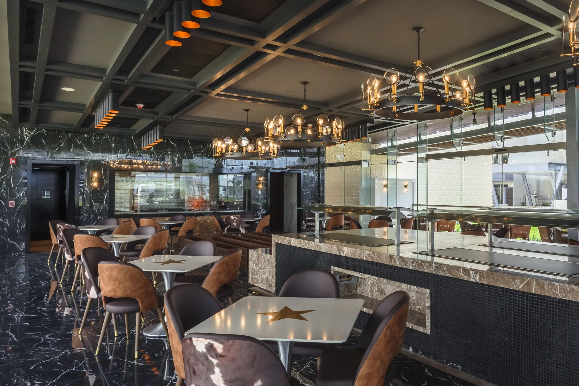 Modern dining room with star-topped tables at Planet Hollywood Cancun.