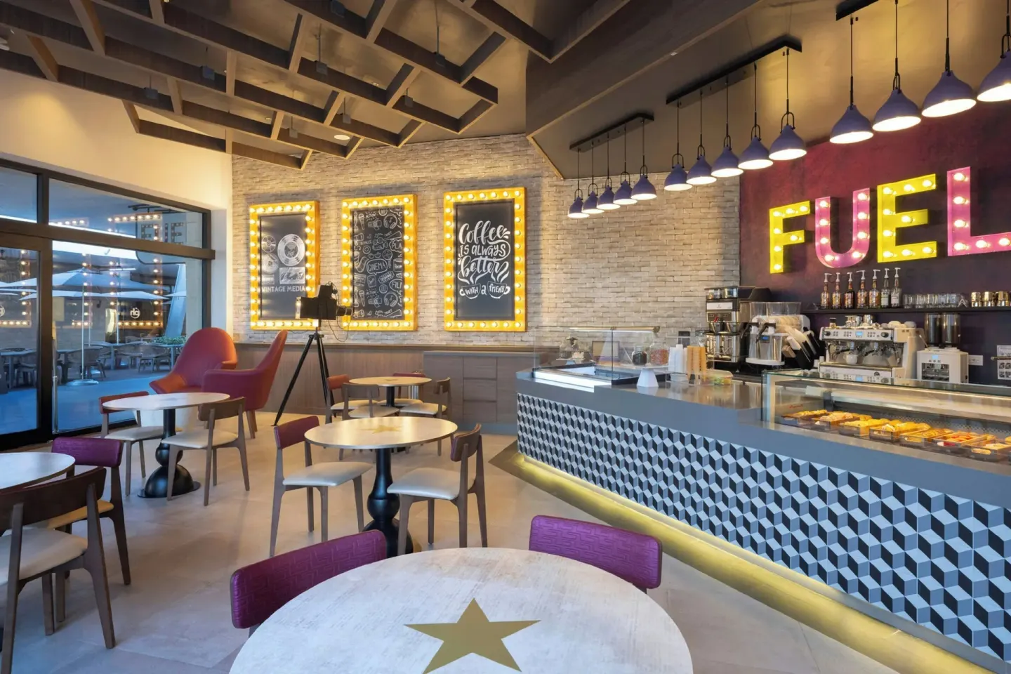 Counter-service café with pastry case and marquee-style decor at Planet Hollywood Cancun.