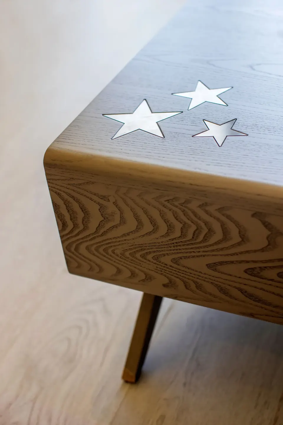 Junior Suite wooden table detail with star inlays at Planet Hollywood Cancun.