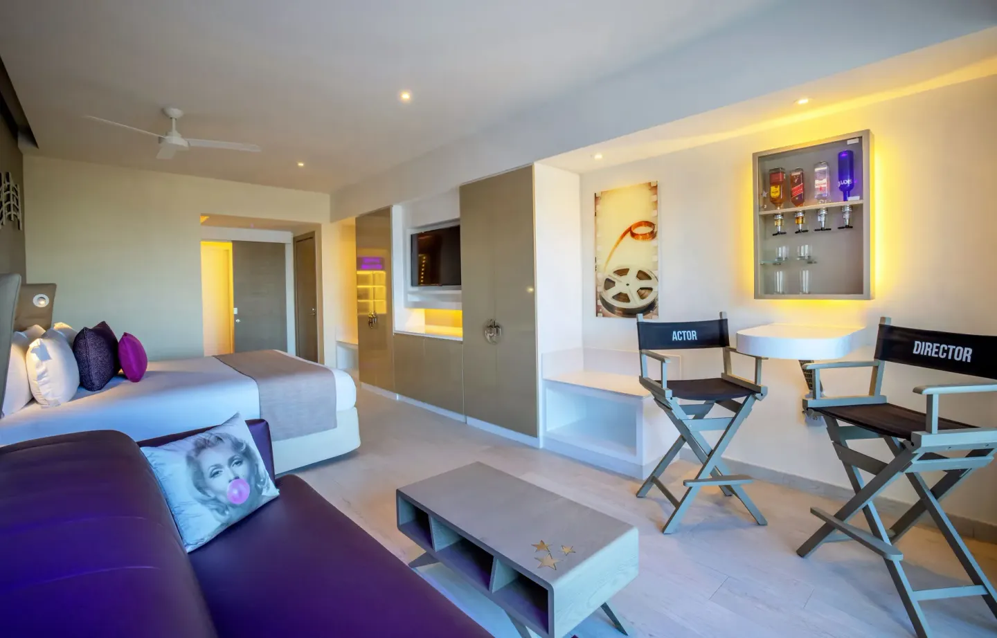 Star Class Junior Suite with king bed, sofa, and director chairs at Planet Hollywood Cancun.