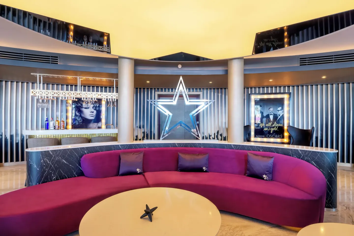 Curved lounge and bar in the Star Class Producers Two Bedroom Suite at Planet Hollywood Cancun.