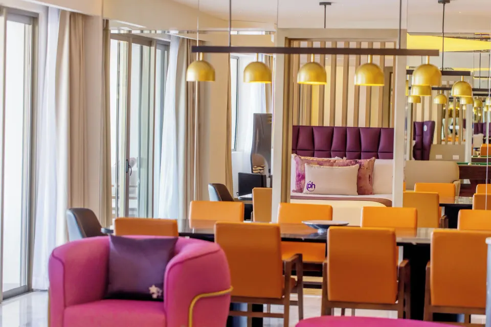 Star Class Producers Two Bedrooms Suite dining area and bedroom at Planet Hollywood Cancun.