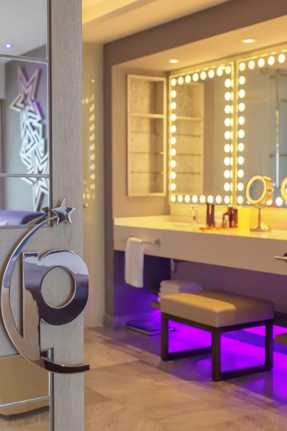 Star Class Producers Two Bedrooms Suite vanity with lighted mirrors at Planet Hollywood Cancun.