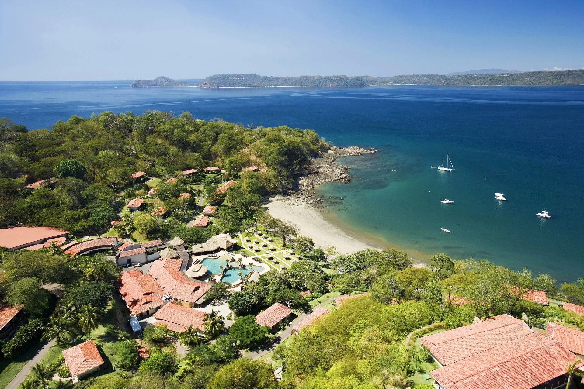 Secrets Papagayo adults-only all-inclusive resort in Costa Rica with oceanfront pools, tropical setting, and romantic atmosphere.