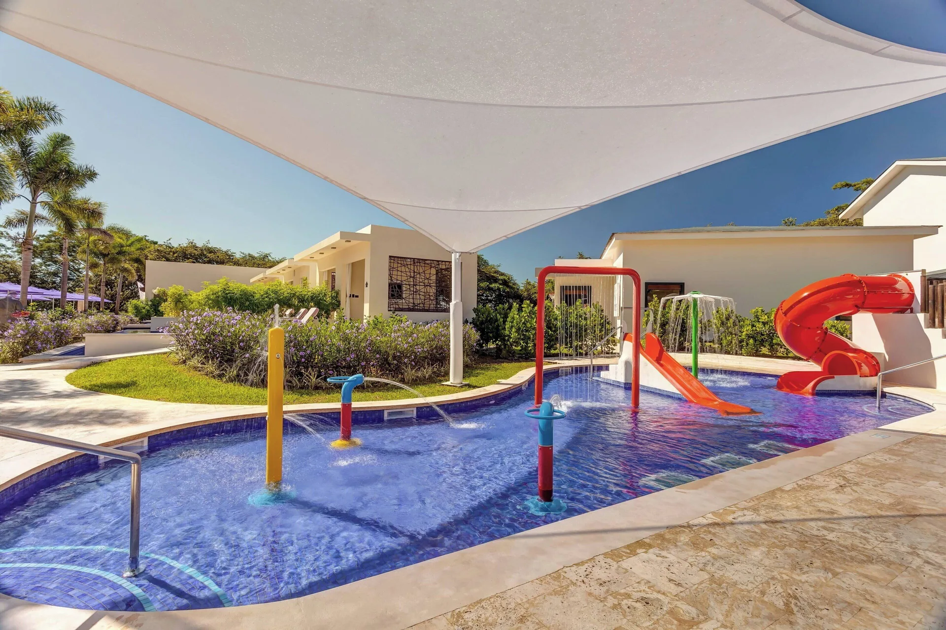 Children's splash pool with slides and spray features at Planet Hollywood Costa Rica.