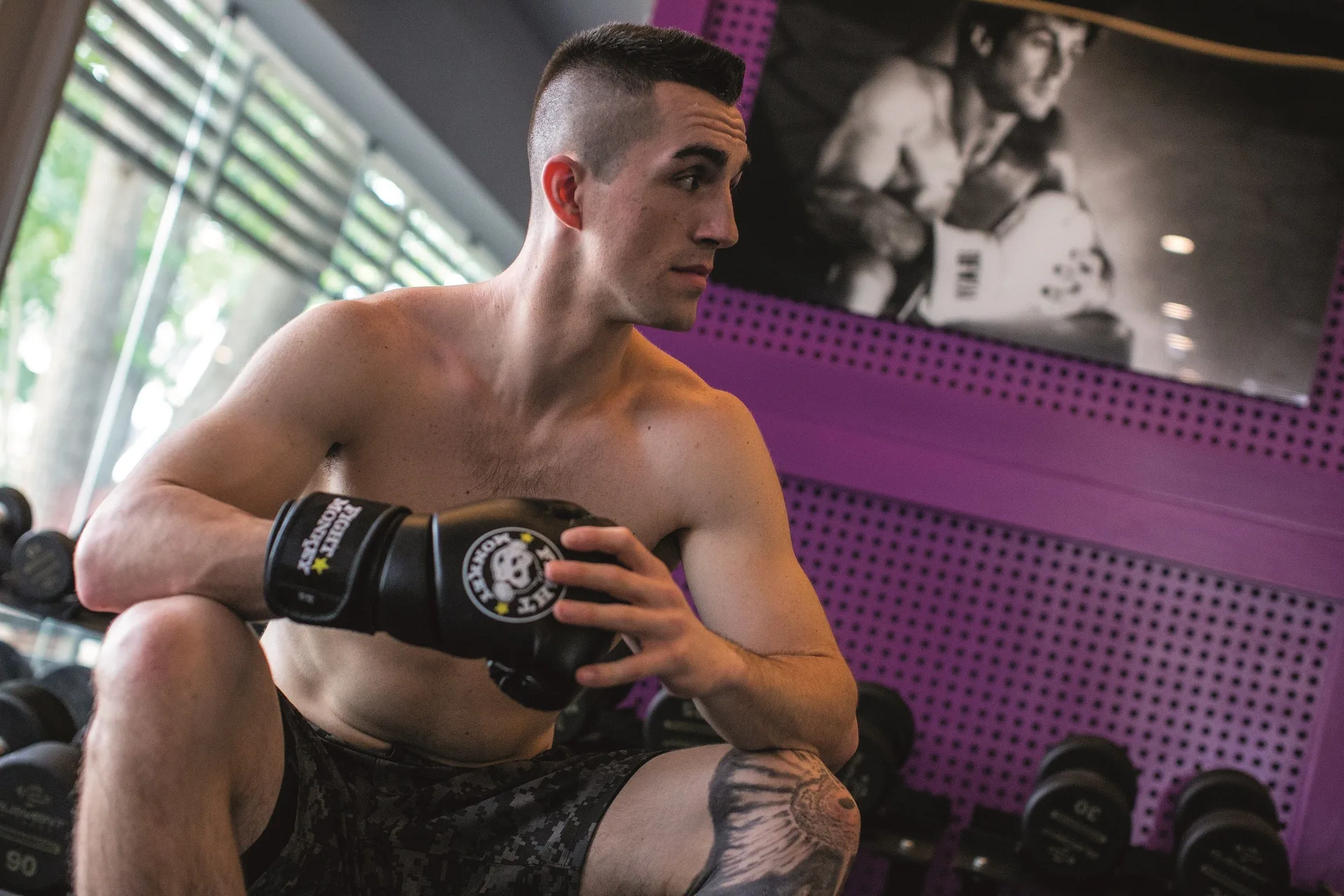 Man wearing boxing gloves in the gym at Planet Hollywood Costa Rica.