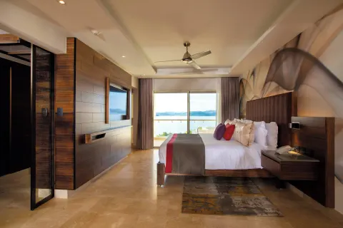 King bed guest room with ocean view at Planet Hollywood Costa Rica.