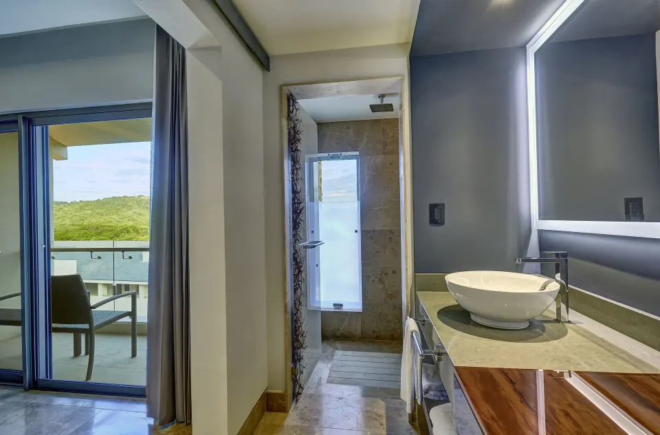 Junior Suite vanity beside balcony doors at Planet Hollywood Costa Rica.