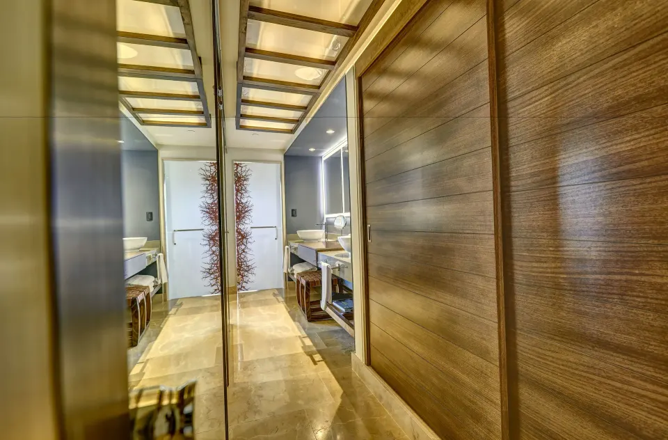 Junior Suite entry with mirrored closet and bathroom view at Planet Hollywood Costa Rica.