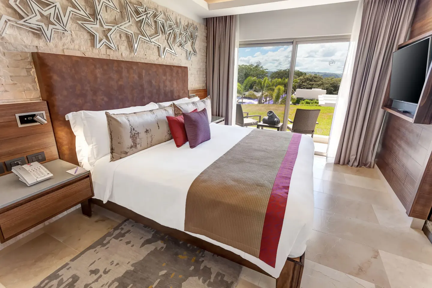 Star Class Director's Suite king bedroom with terrace view at Planet Hollywood Costa Rica.