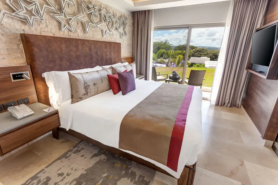 Star Class Director's Suite king bedroom with terrace view at Planet Hollywood Costa Rica.