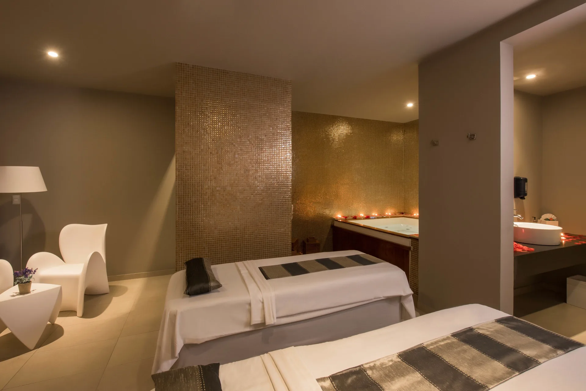 Couples treatment room with massage tables and tub at Platinum Yucatan Princess.