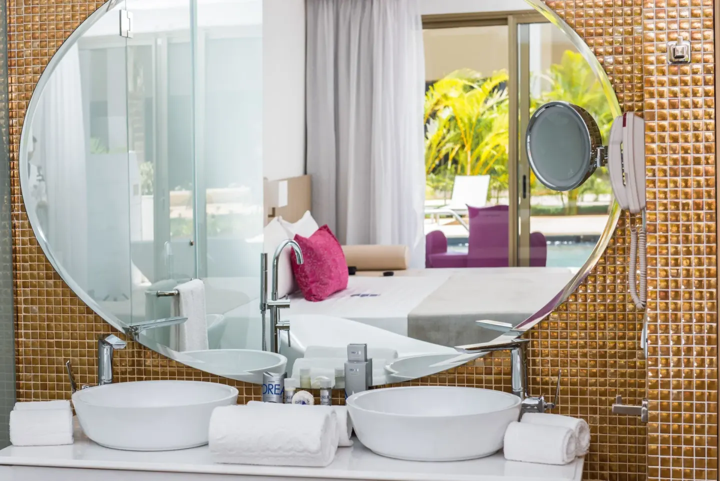 Double-sink bathroom vanity with round mirror at Platinum Yucatan Princess.
