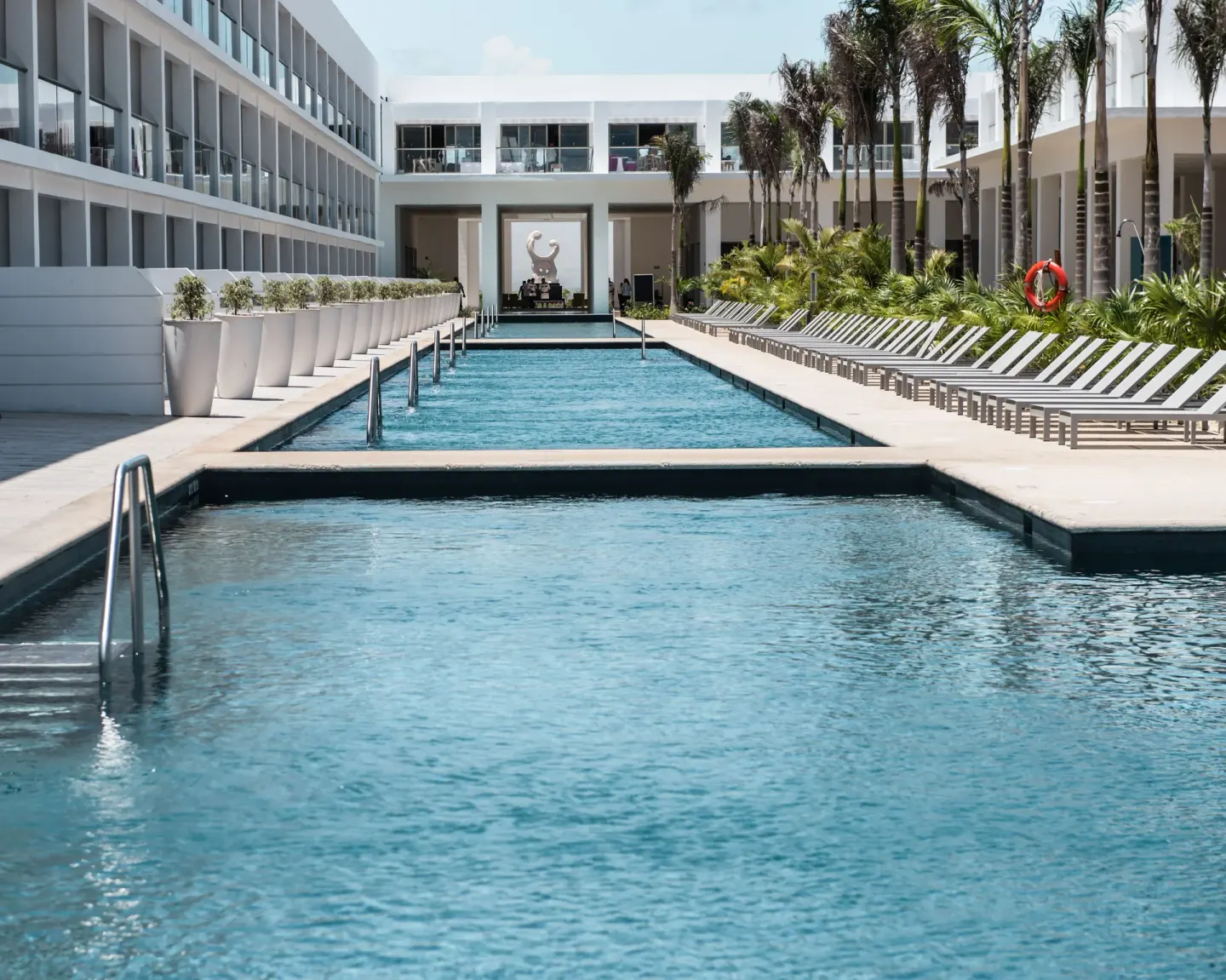 Long swim-up style pool corridor with loungers at Platinum Yucatan Princess.