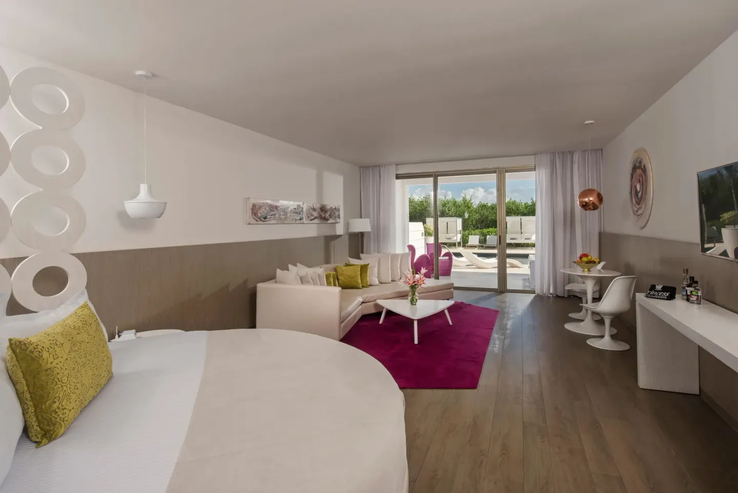 Round-bed suite with terrace lounge chairs at Platinum Yucatan Princess.
