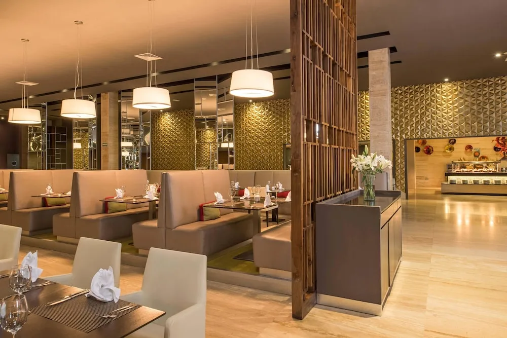 Modern buffet dining room with booth seating at Platinum Yucatan Princess.