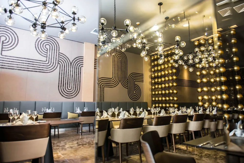 Elegant restaurant tables with globe lights at Platinum Yucatan Princess.